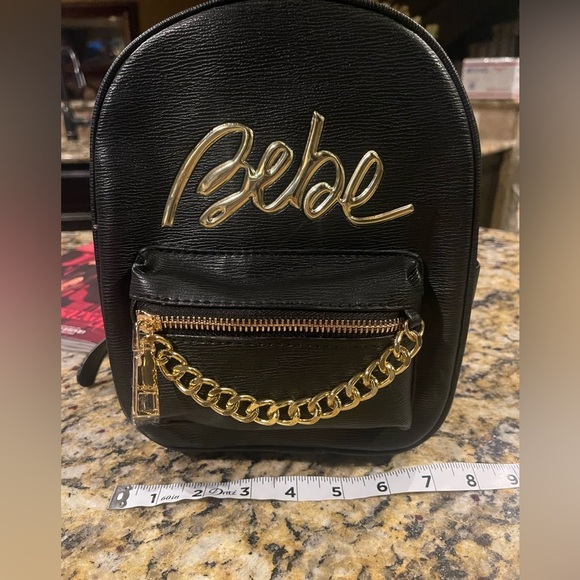 bebe Accessories - NWT BEBE small black gold chain mini backpack
